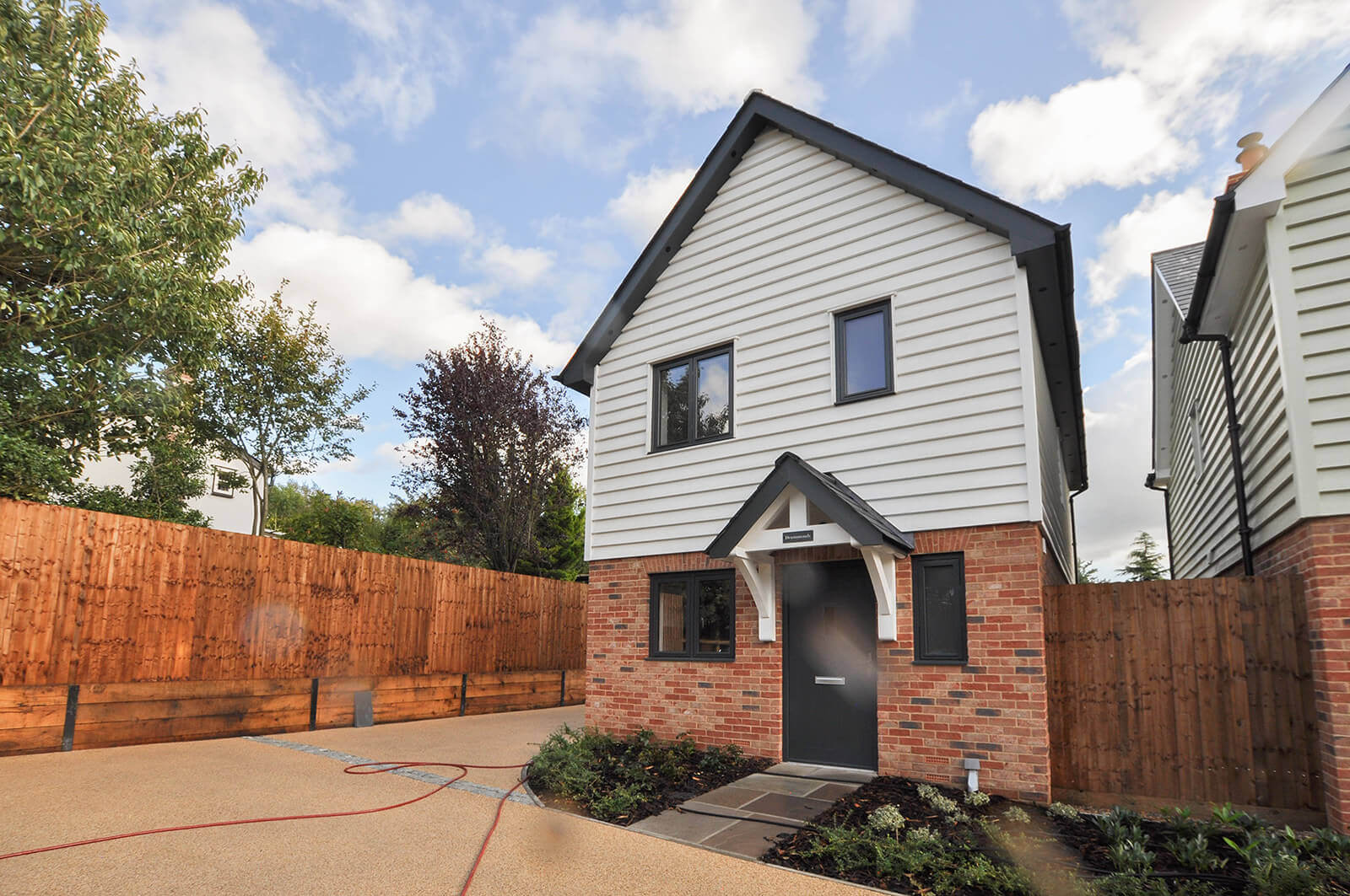 Front view of Drummonds detached house, showing driveway to the front an side of the house.