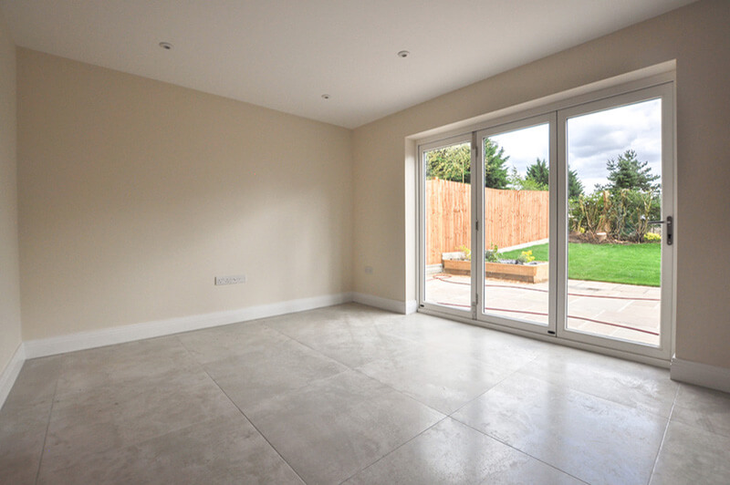 Dining area with bi-fold doors looking out onto rear garden.